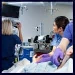 nurses working looking at a monitor